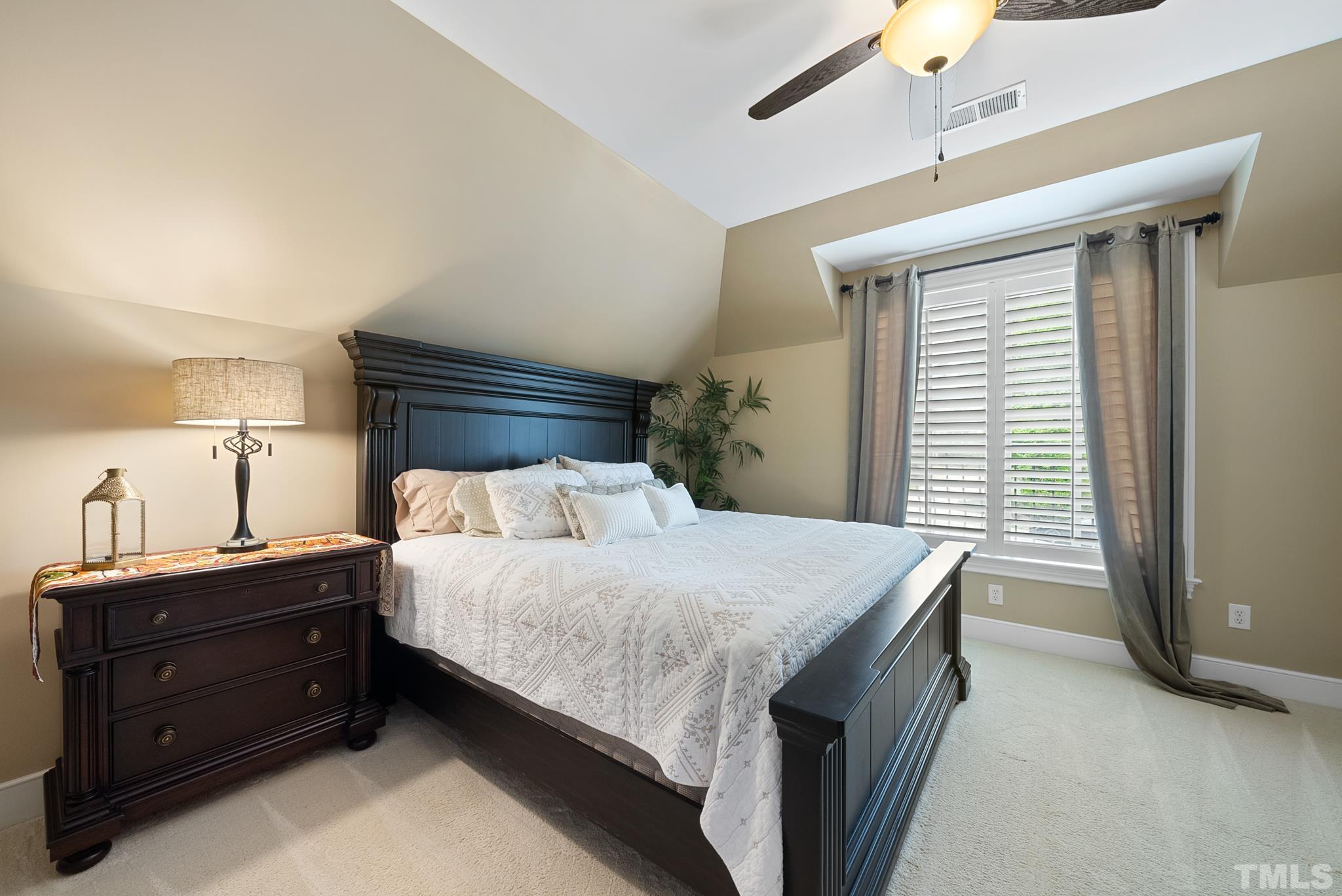 1204 Hedgelawn Way Raleigh, NC 27615 - Photo 27 of 44 a bedroom with a bed and a window