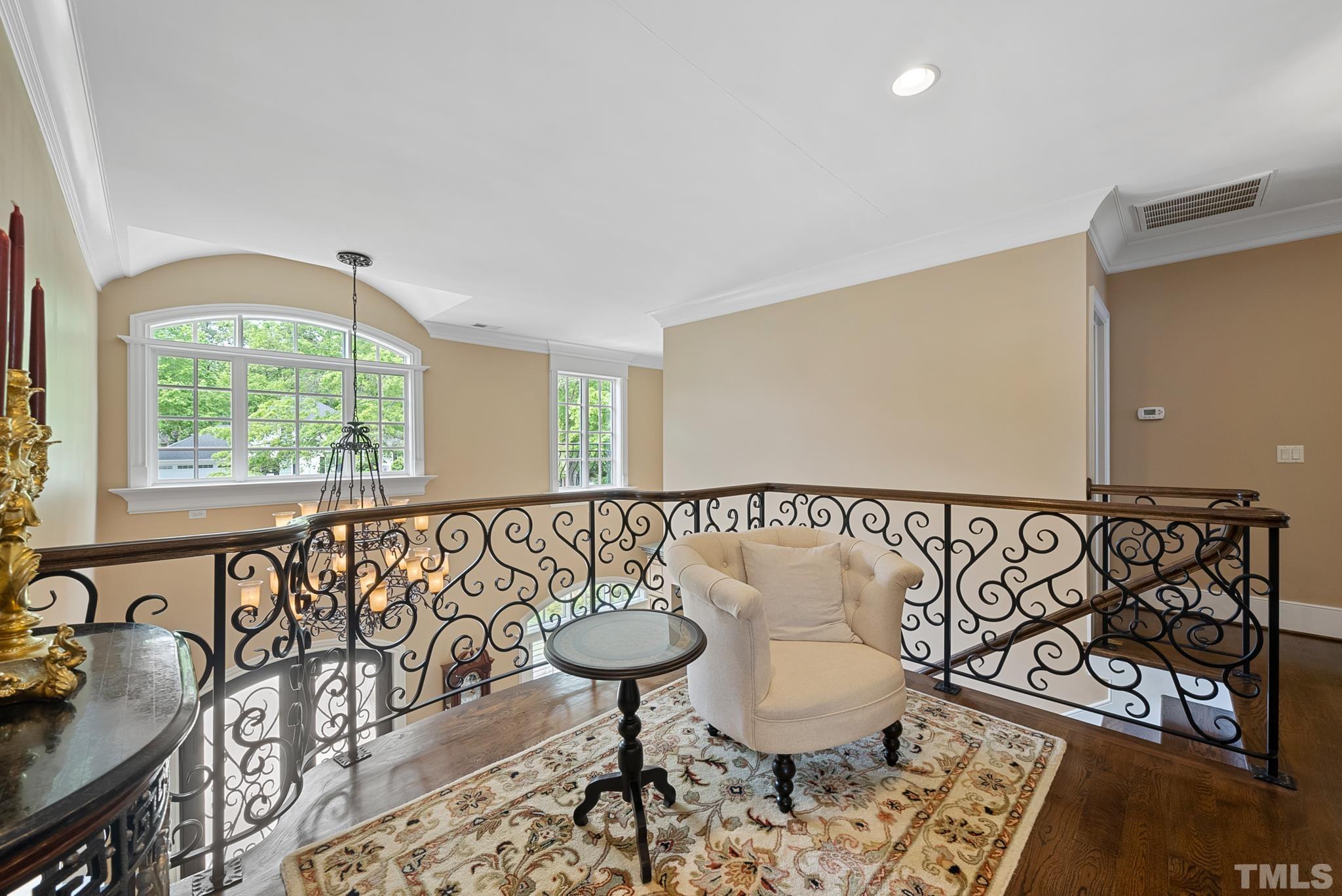 1204 Hedgelawn Way Raleigh, NC 27615 - Photo 28 of 44 a view of a livingroom with furniture window and a wooden floor