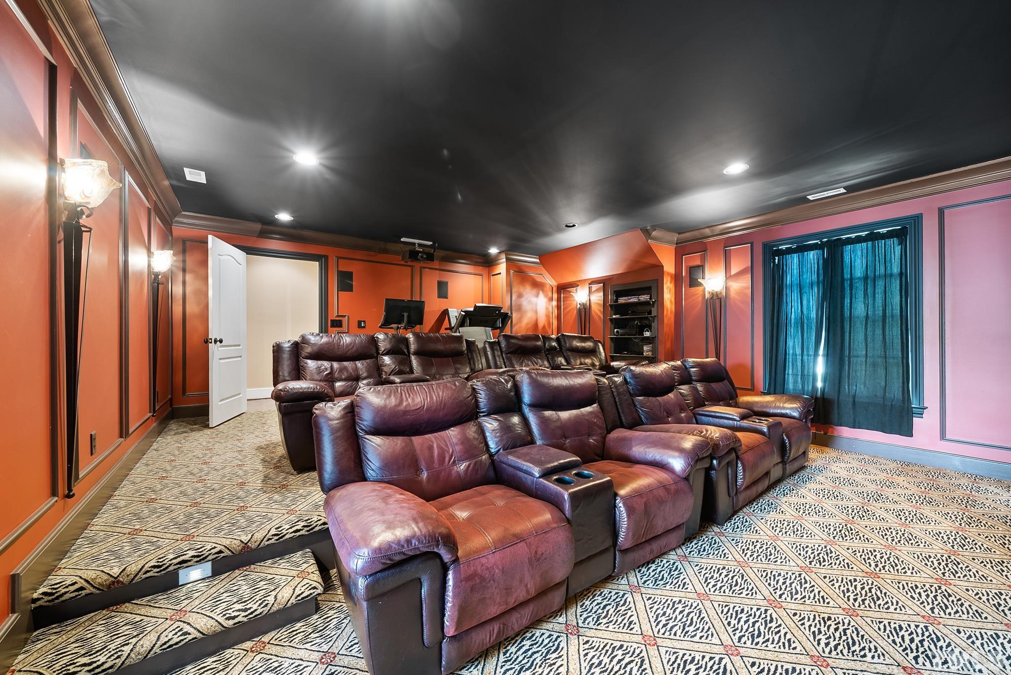 1204 Hedgelawn Way Raleigh, NC 27615 - Photo 31 of 44 a media room with lots of chairs and a projector