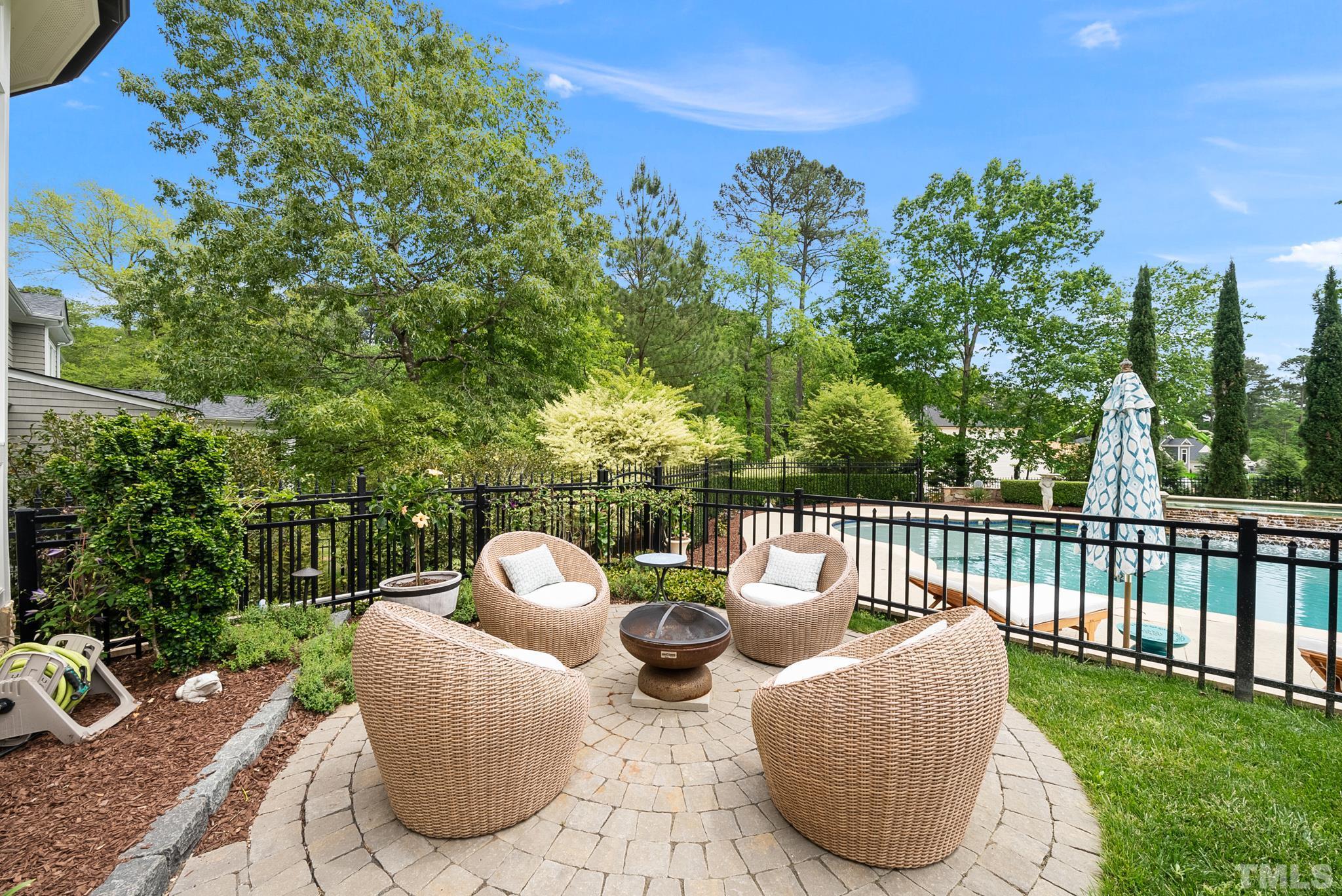 1204 Hedgelawn Way Raleigh, NC 27615 - Photo 36 of 44 a view of a two chairs and a table in the back yard