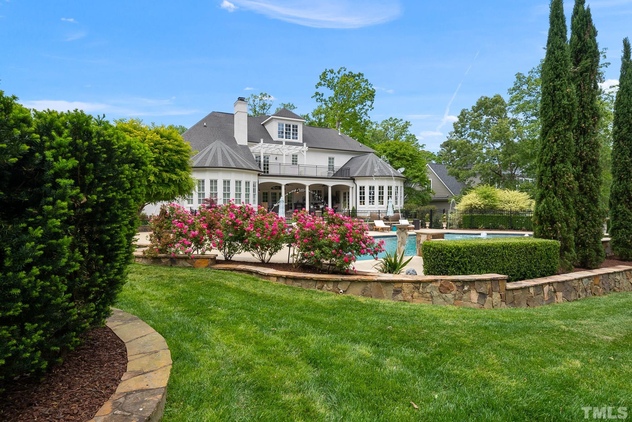 1204 Hedgelawn Way Raleigh, NC 27615 - Photo 40 of 44 a front view of a house with a yard table and chairs