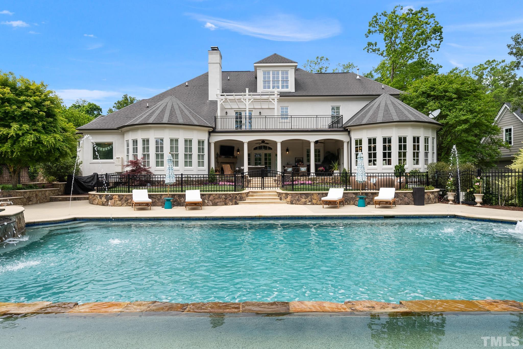 1204 Hedgelawn Way Raleigh, NC 27615 - Photo 4 of 44 a front view of a house with swimming pool having outdoor seating