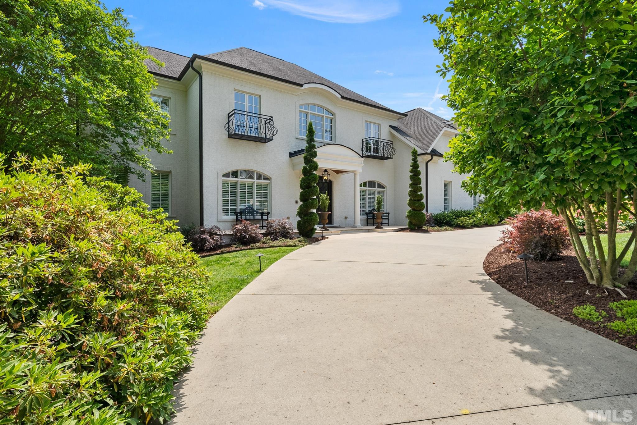 1204 Hedgelawn Way Raleigh, NC 27615 - Photo 42 of 44 a front view of a house with a yard and trees