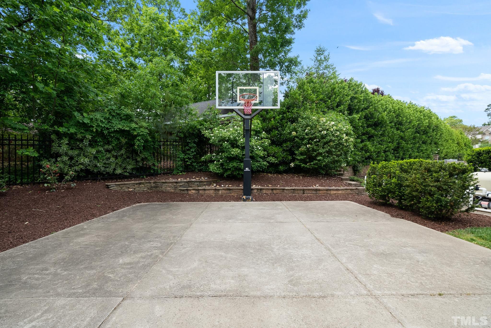 1204 Hedgelawn Way Raleigh, NC 27615 - Photo 44 of 44 a view of a street with potted plants and large trees