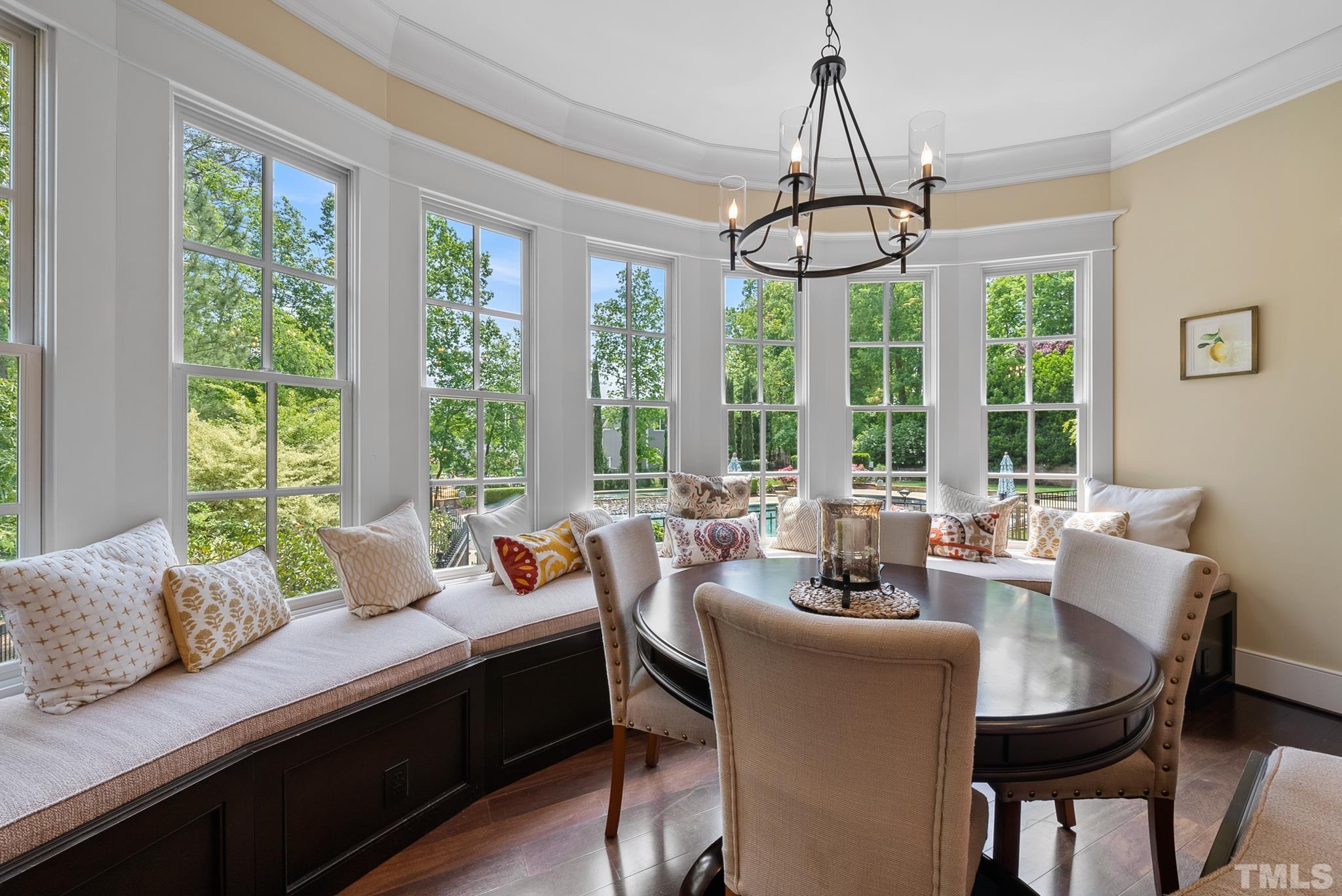 1204 Hedgelawn Way Raleigh, NC 27615 - Photo 9 of 44 a view of a dining room with furniture window and outside view