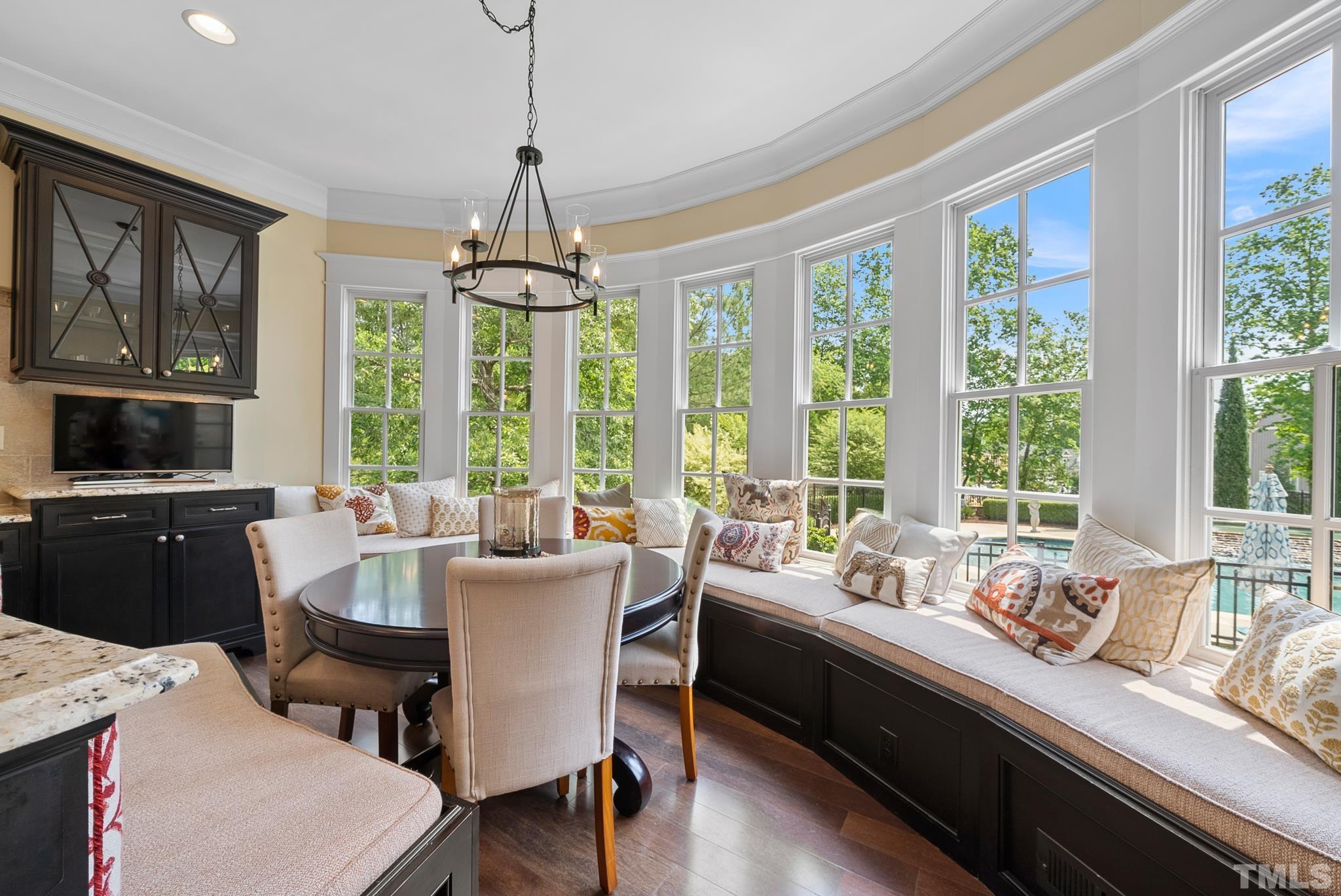 1204 Hedgelawn Way Raleigh, NC 27615 - Photo 10 of 44 a living room with furniture and large windows