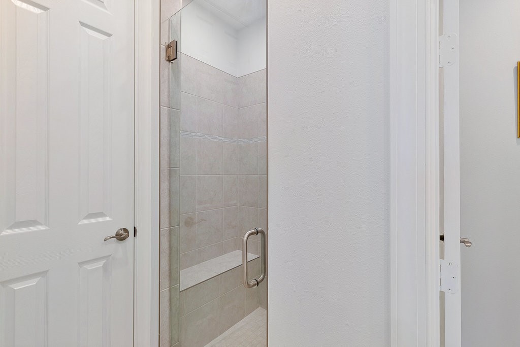 5967 Bella Rosa Lane Vero Beach, FL 32966 - Photo 15 of 30 a bathroom with a glass shower door
