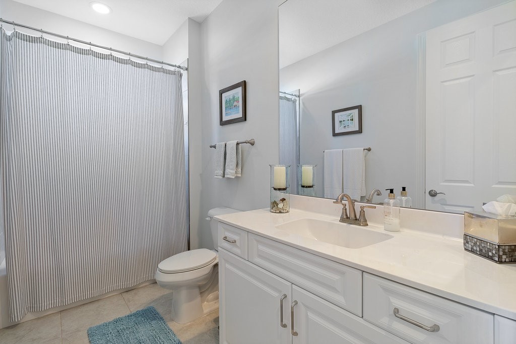 5967 Bella Rosa Lane Vero Beach, FL 32966 - Photo 18 of 30 a bathroom with a sink toilet and shower