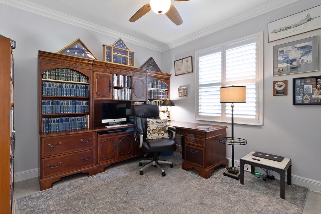 5967 Bella Rosa Lane Vero Beach, FL 32966 - Photo 19 of 30 a view of a workspace with furniture and a window
