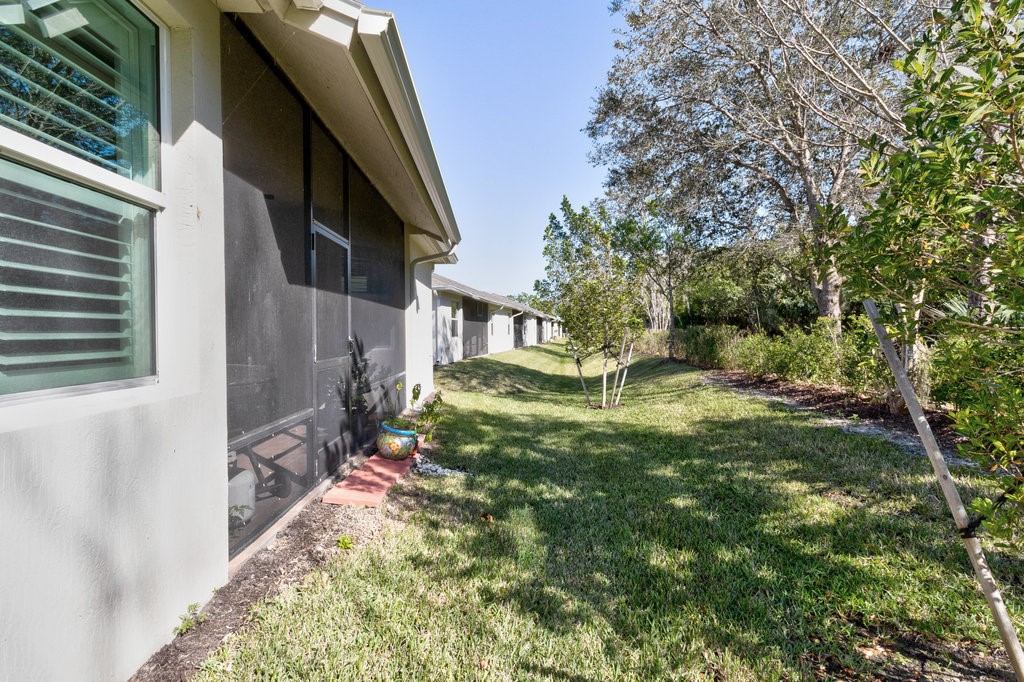 5967 Bella Rosa Lane Vero Beach, FL 32966 - Photo 24 of 30 a view of back yard of the house