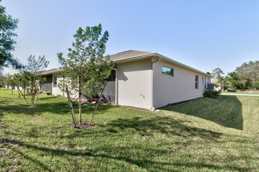 5967 Bella Rosa Lane Vero Beach, FL 32966 - Photo 27 of 30 a view of a house with a yard