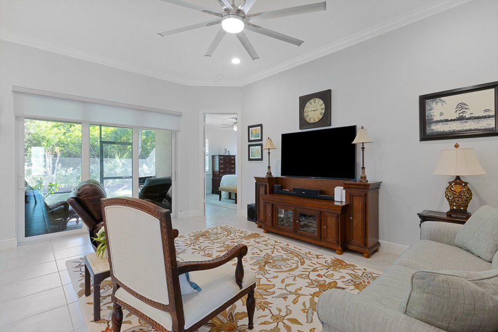 5967 Bella Rosa Lane Vero Beach, FL 32966 - Photo 4 of 30 a living room with furniture and a flat screen tv