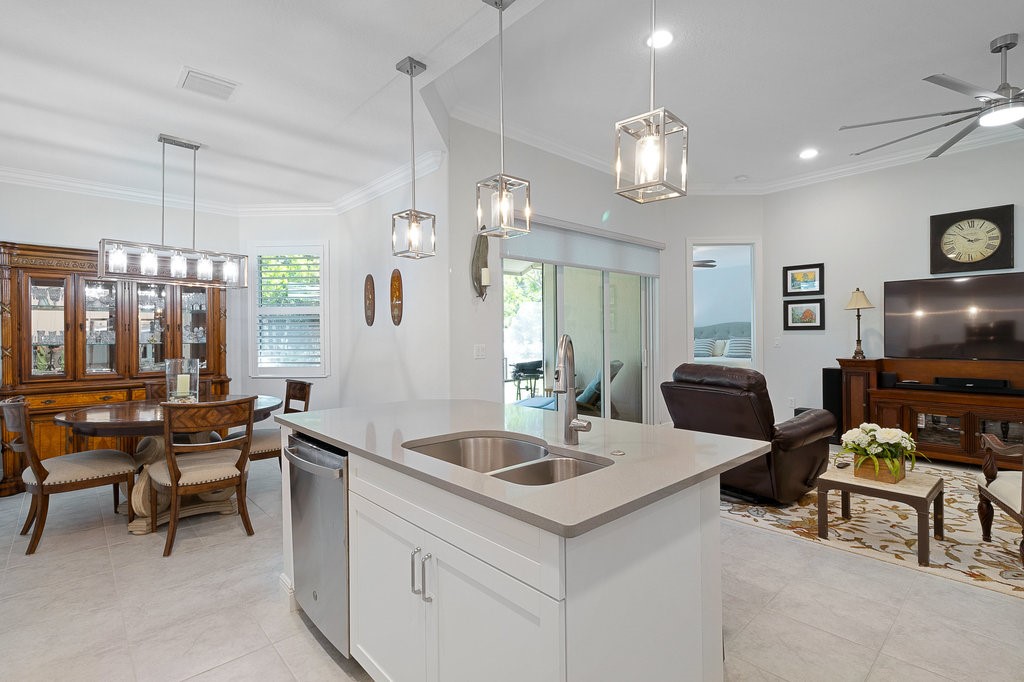 5967 Bella Rosa Lane Vero Beach, FL 32966 - Photo 10 of 30 a living room with furniture a flat screen tv and outdoor view
