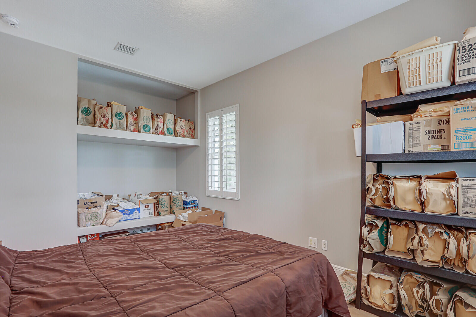 101 St Pierre Way Jupiter, FL 33458 - Photo 33 of 57 a bedroom with a bed and dresser