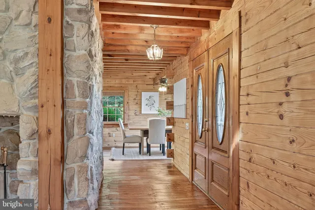 a view of a room with a table and chairs