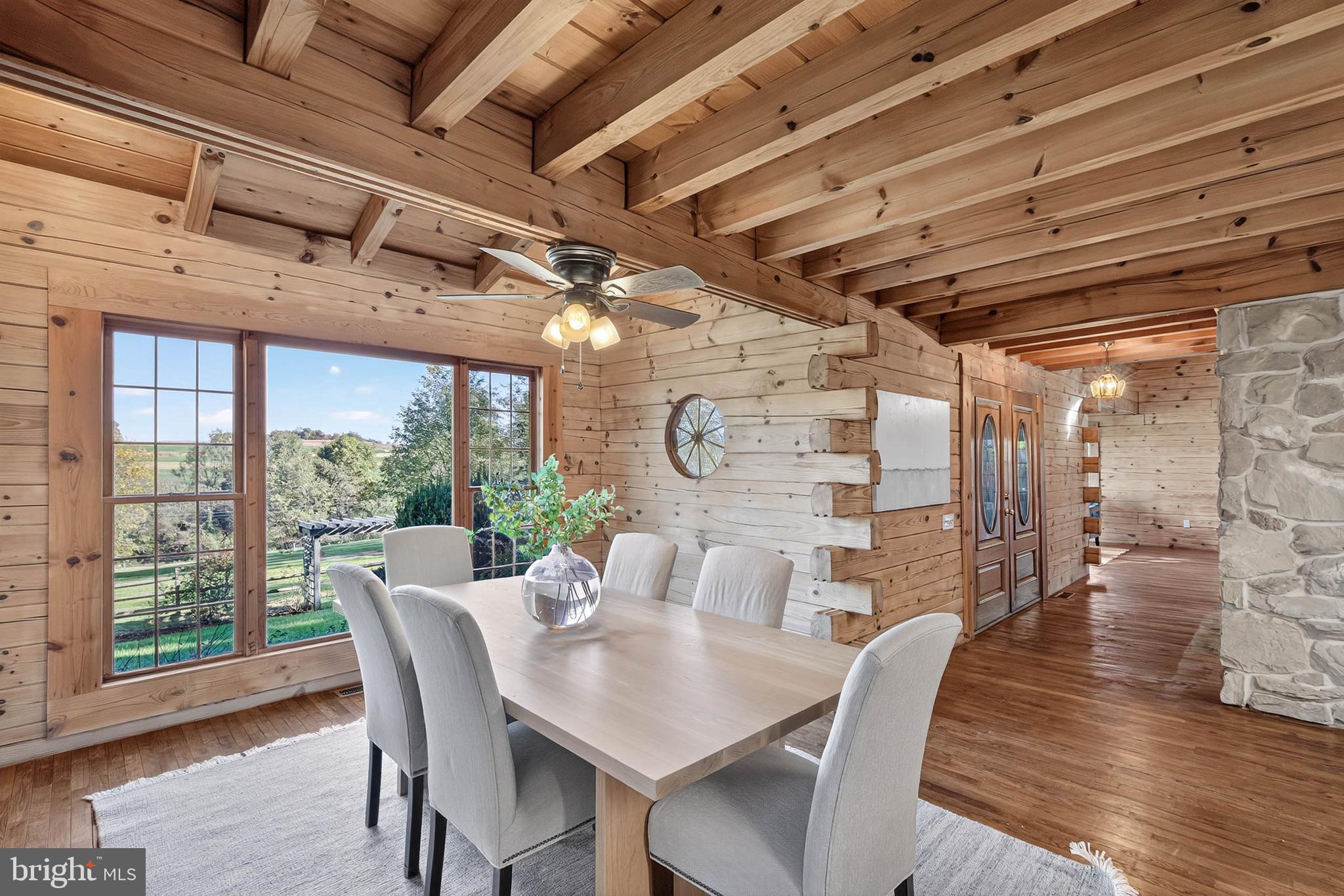 140 Arcadia Trace Peach Bottom, PA 17563 - Photo 18 of 63 a view of a dining room with furniture wooden floor and a chandelier