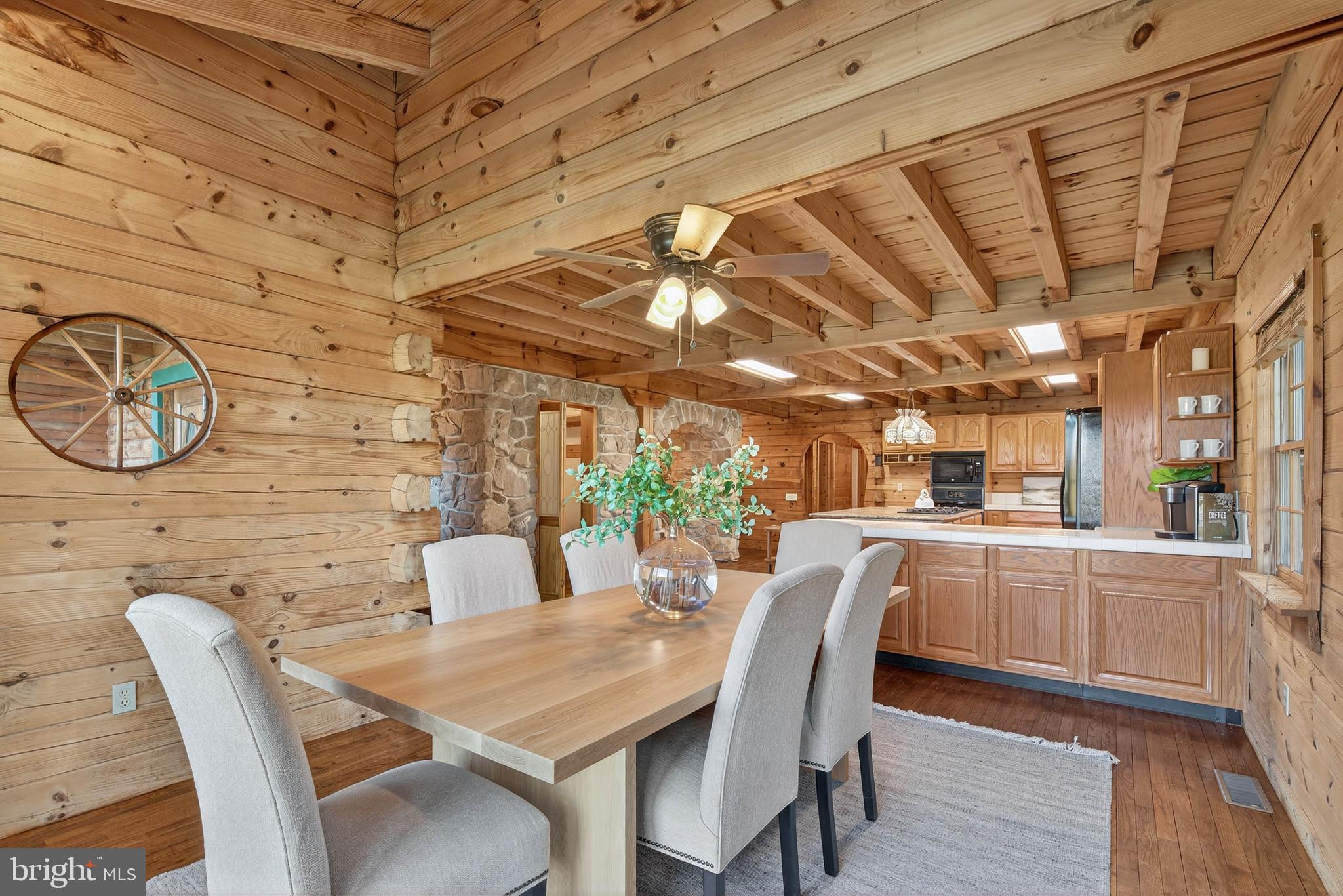 140 Arcadia Trace Peach Bottom, PA 17563 - Photo 20 of 63 a dining room with furniture and a floor to ceiling window