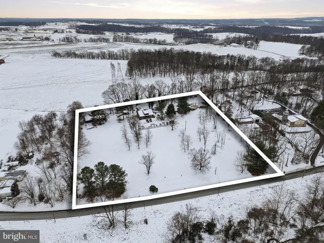 a view of a livingroom with furniture and a fireplace