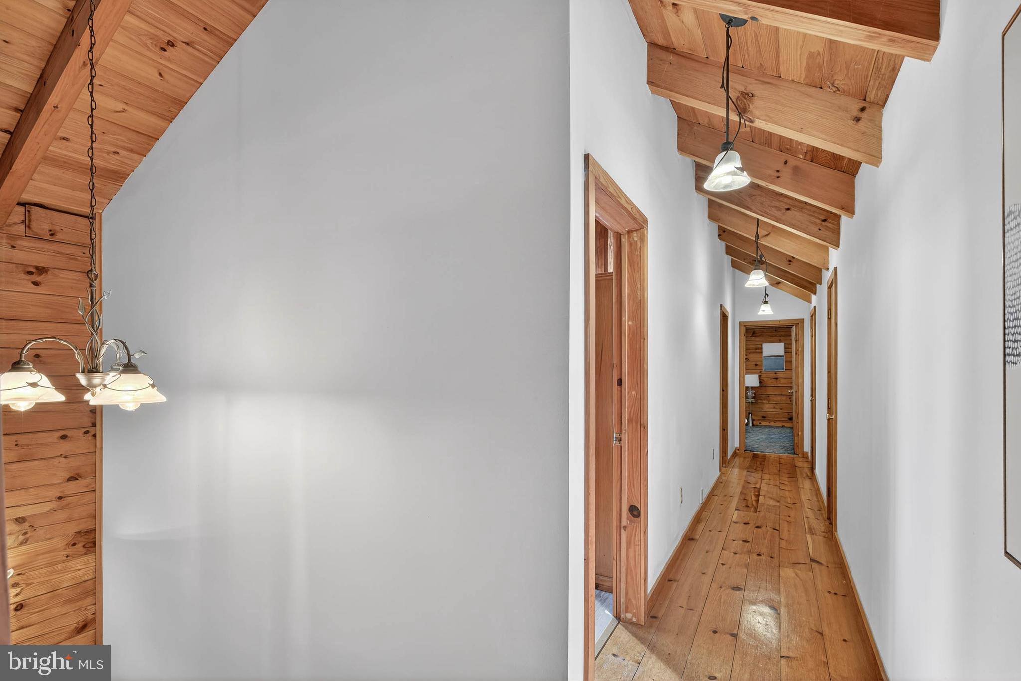 140 Arcadia Trace Peach Bottom, PA 17563 - Photo 45 of 63 a view of a hallway with wooden floor and staircase