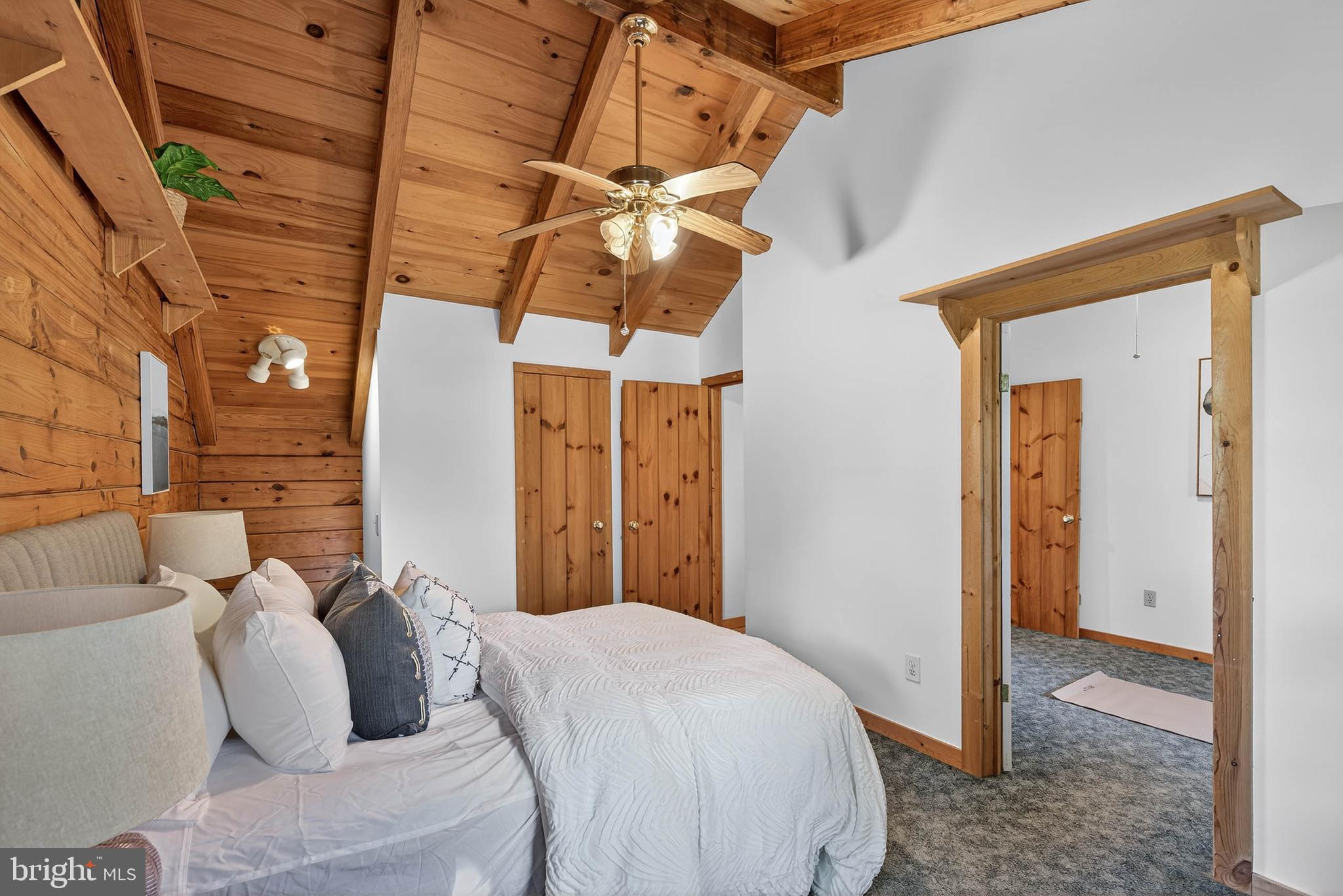 140 Arcadia Trace Peach Bottom, PA 17563 - Photo 48 of 63 a bedroom with a bed and a chandelier