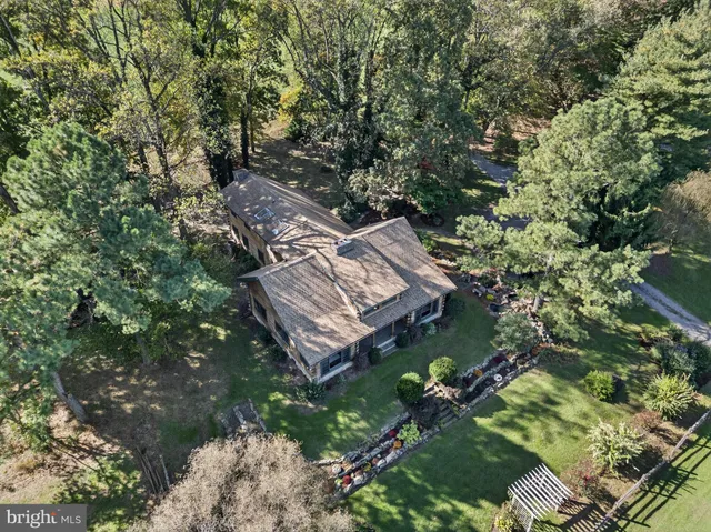 a view of a dining room with furniture wooden floor and a chandelier