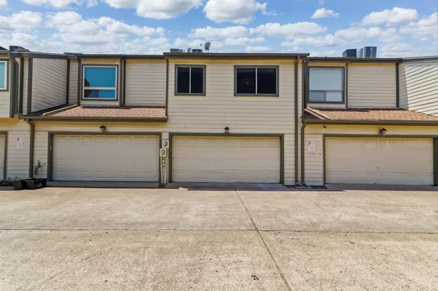 a front view of a house with garage