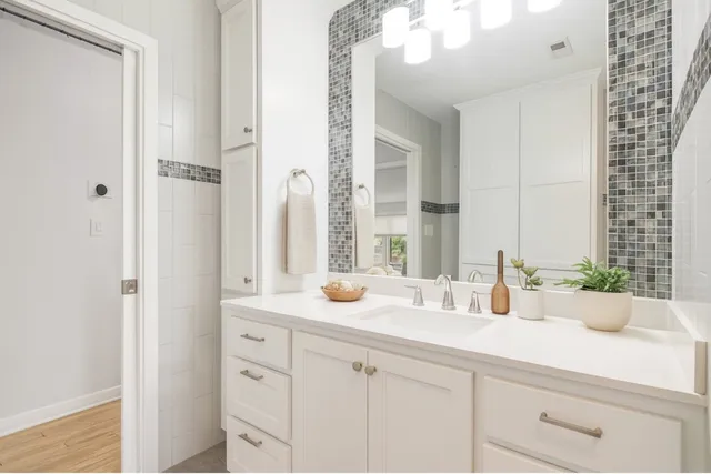 a bathroom with a sink and a mirror