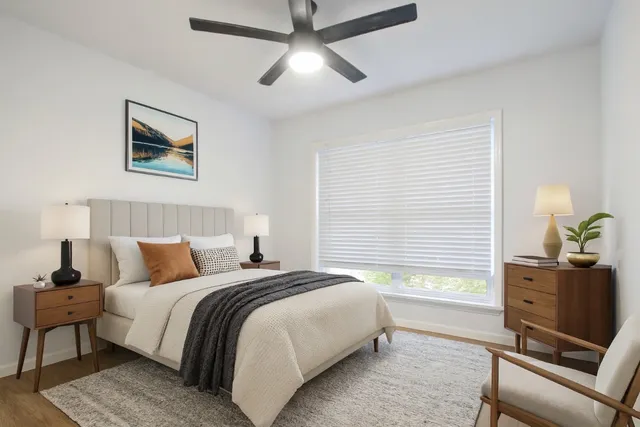 a bedroom with a bed and furniture