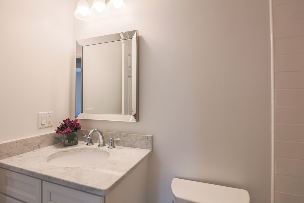 11 Sunset Road, Unit 2 Cambridge, MA 02138 - Photo 20 of 29 a bathroom with a sink and a mirror