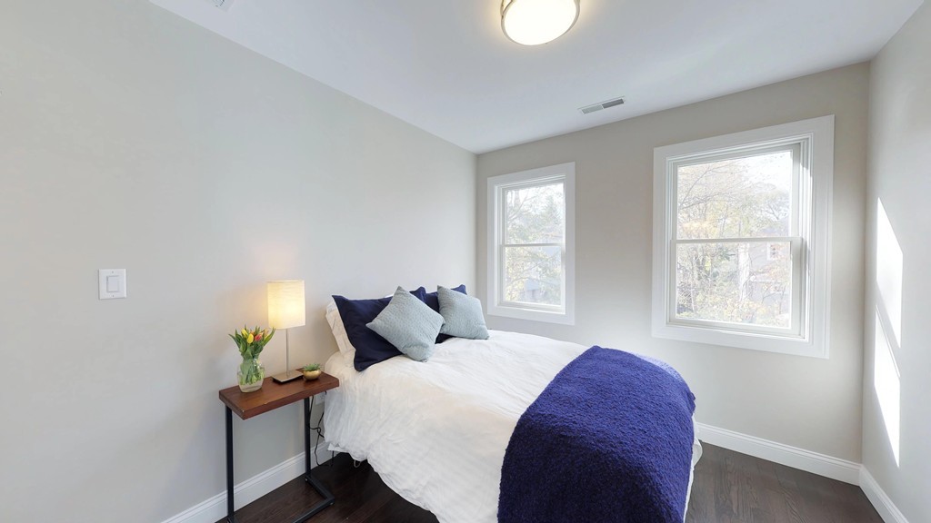 11 Sunset Road, Unit 2 Cambridge, MA 02138 - Photo 22 of 29 a bedroom with a bed and a window