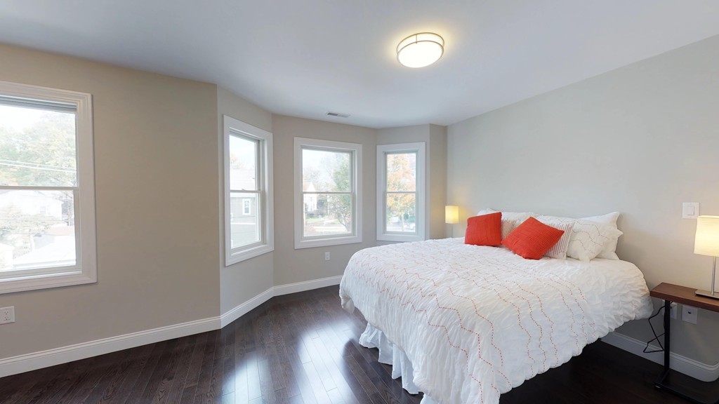 11 Sunset Road, Unit 2 Cambridge, MA 02138 - Photo 23 of 29 a bedroom with a bed and a window