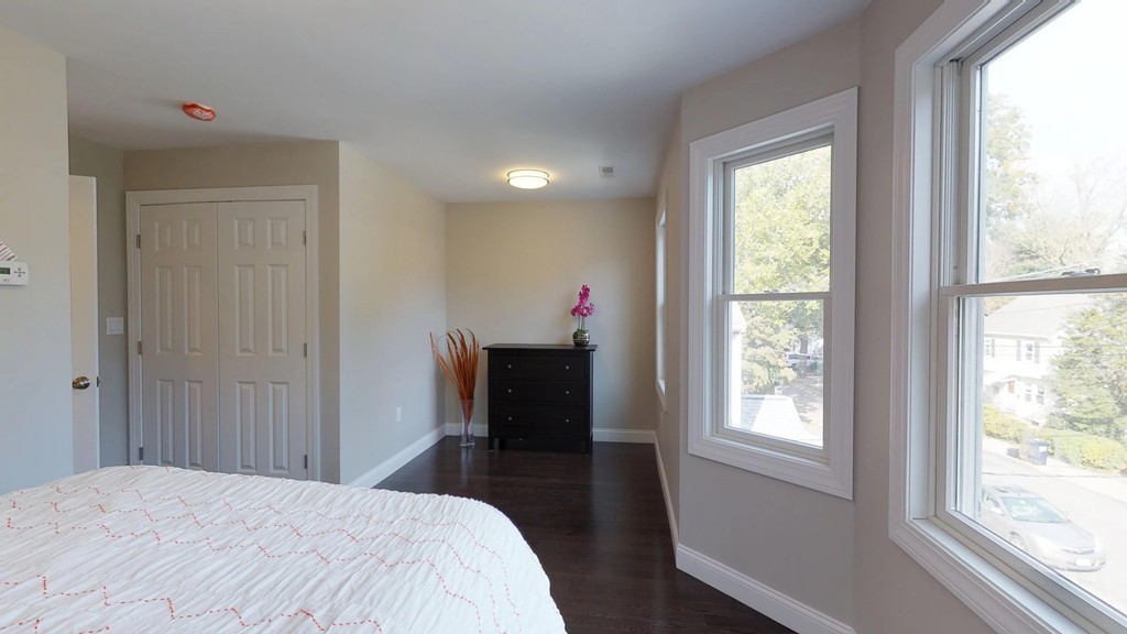 11 Sunset Road, Unit 2 Cambridge, MA 02138 - Photo 24 of 29 a bedroom with a bed and a window
