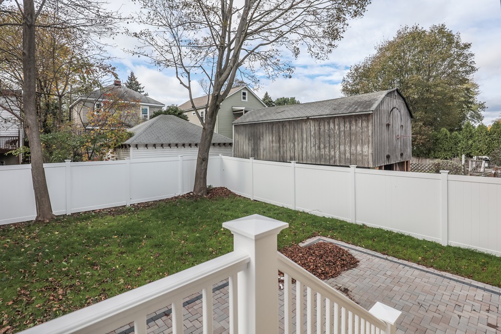 11 Sunset Road, Unit 2 Cambridge, MA 02138 - Photo 26 of 29 a view of a wooden fence and trees