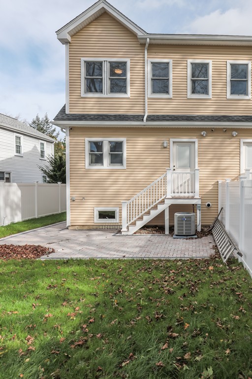 11 Sunset Road, Unit 2 Cambridge, MA 02138 - Photo 28 of 29 a view of a house with a yard