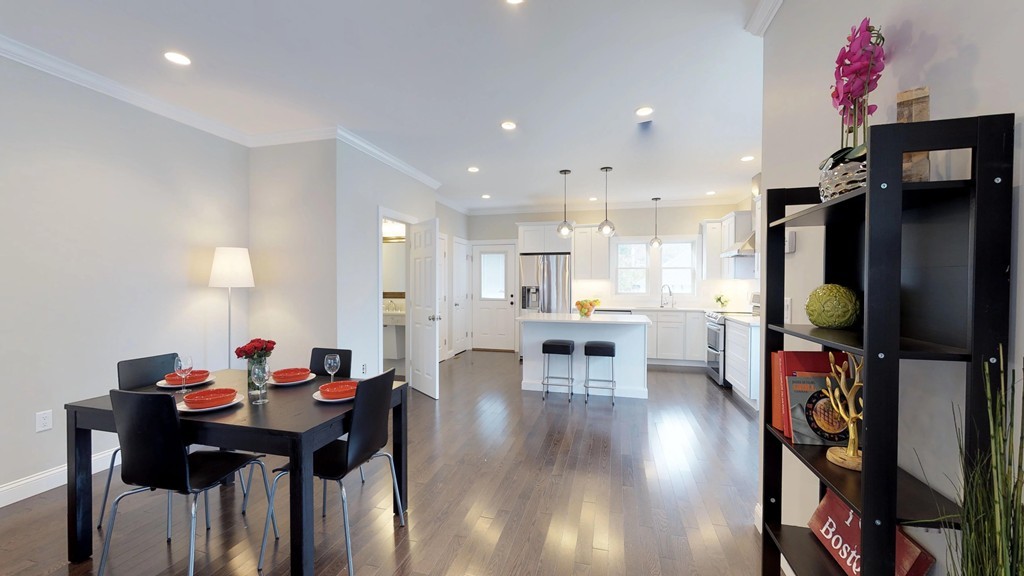 11 Sunset Road, Unit 2 Cambridge, MA 02138 - Photo 3 of 29 a view of a dining room with furniture and chandelier