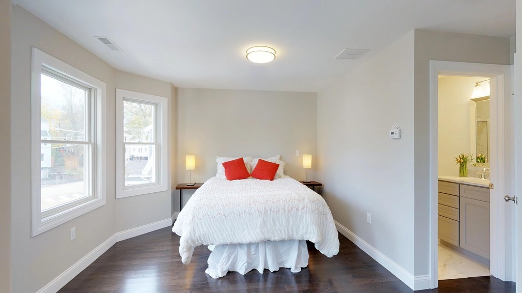 11 Sunset Road, Unit 2 Cambridge, MA 02138 - Photo 5 of 29 a bedroom with a bed and wooden floor