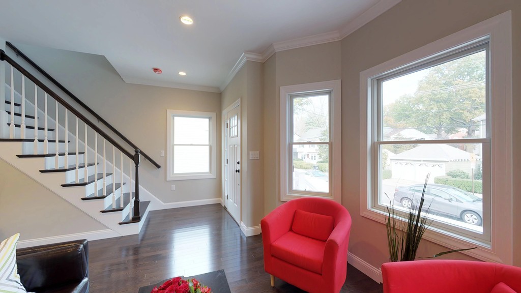 11 Sunset Road, Unit 2 Cambridge, MA 02138 - Photo 9 of 29 a living room with furniture and a floor to ceiling window