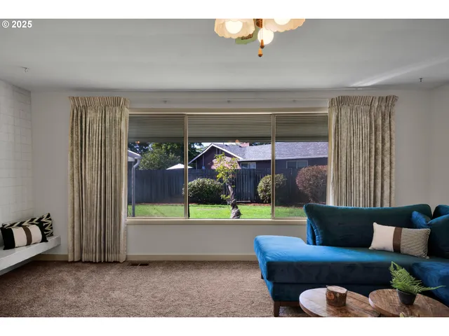 a living room with furniture and a yard