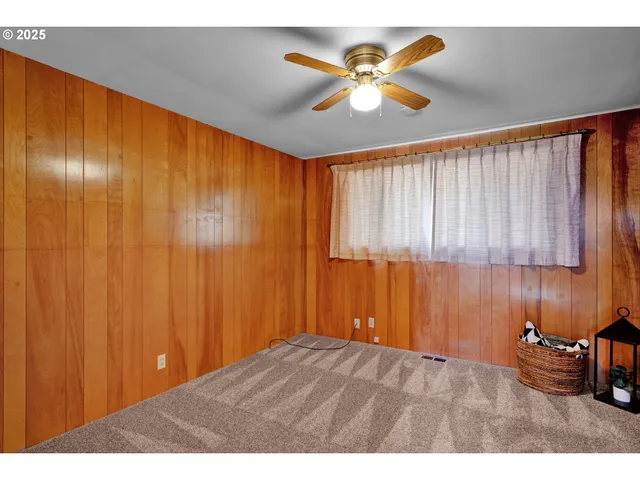 a view of an empty room and a window