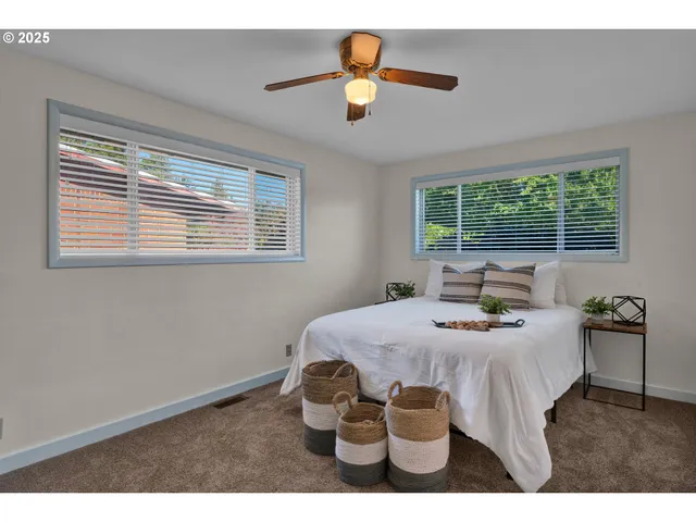 a bedroom with a bed and window