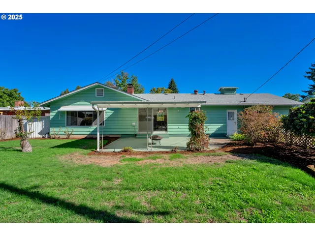 a view of a house with a yard porch and sitting area