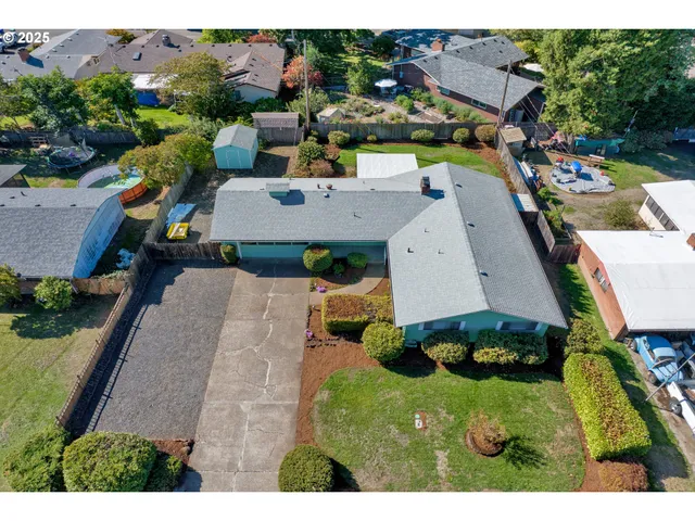 an aerial view of a house with a garden