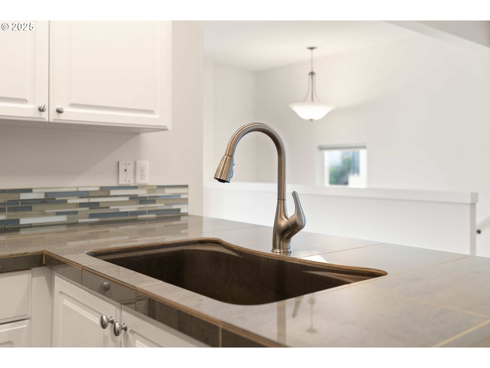 15664 Southwest Ivory Street Beaverton, OR 97007 - Photo 18 of 40 a kitchen with a sink and a stove