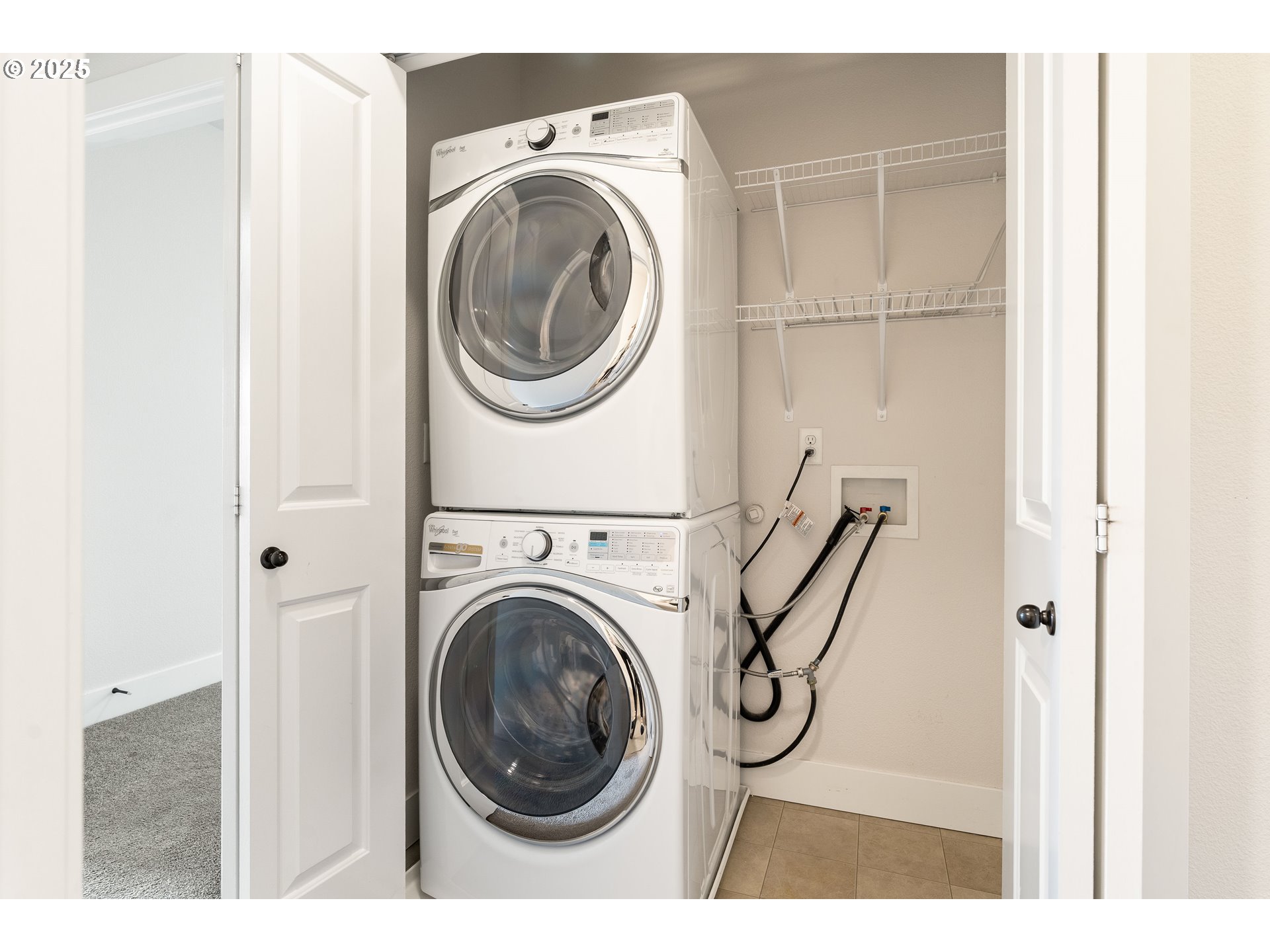15664 Southwest Ivory Street Beaverton, OR 97007 - Photo 19 of 40 a view of a storage & utility room with dryer and washer