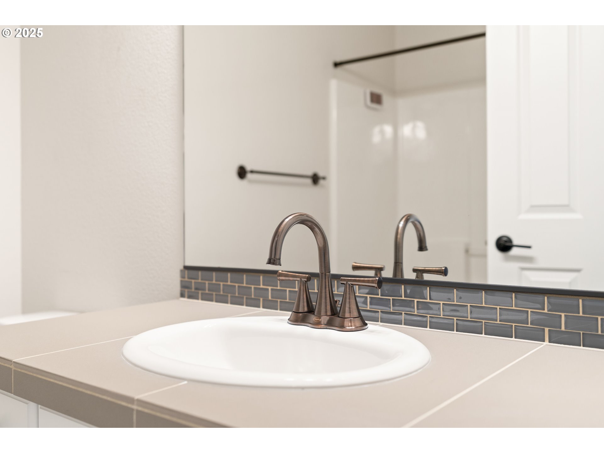 15664 Southwest Ivory Street Beaverton, OR 97007 - Photo 22 of 40 a bathroom with a sink and a mirror