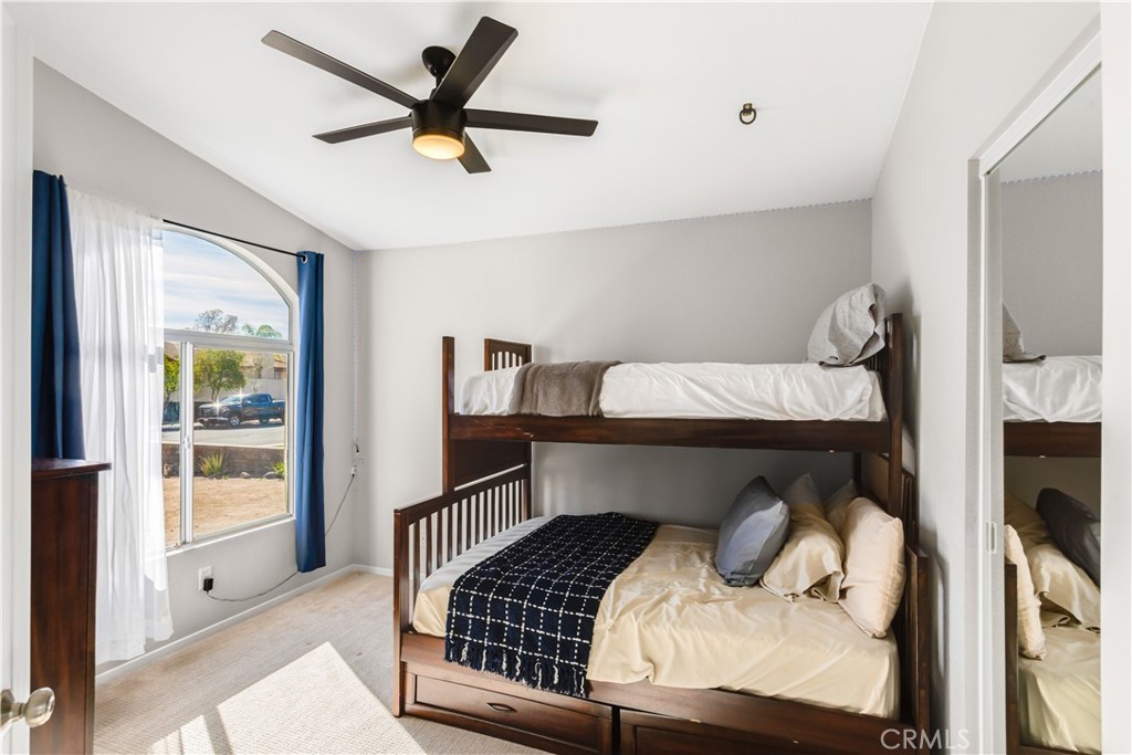 33012 Tulley Ranch Road Temecula, CA 92592 - Photo 11 of 25 a bedroom with a bed and a tv