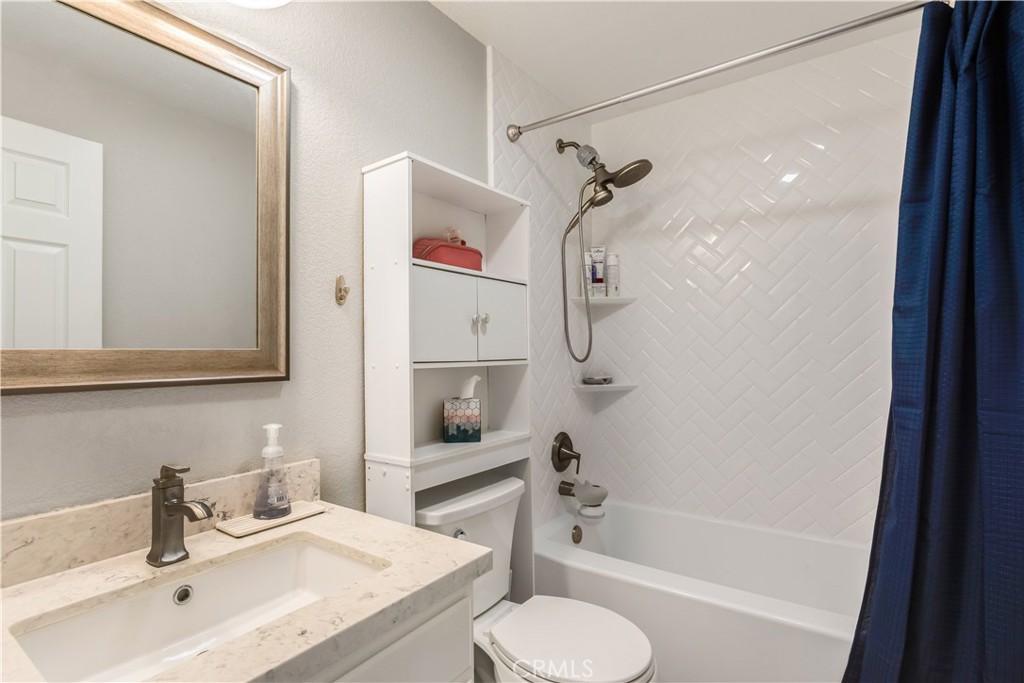 33012 Tulley Ranch Road Temecula, CA 92592 - Photo 13 of 25 a bathroom with a sink toilet and shower