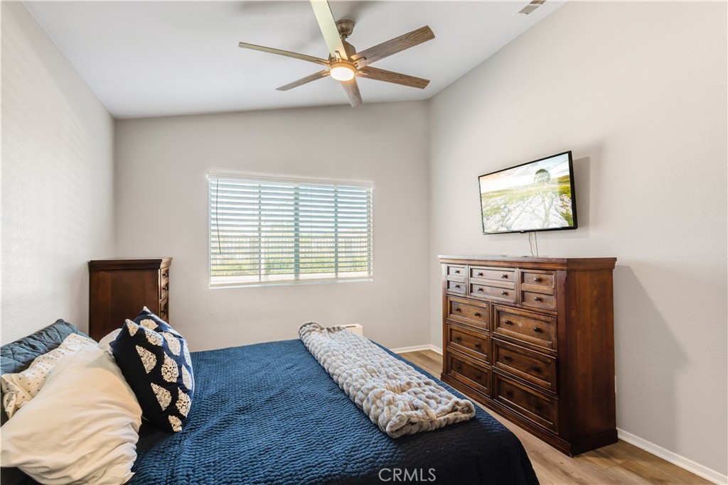33012 Tulley Ranch Road Temecula, CA 92592 - Photo 16 of 25 a bedroom with bed and a window