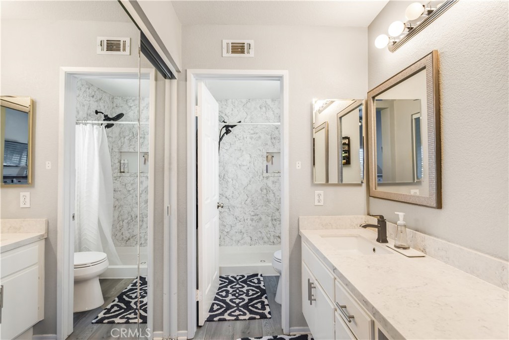 33012 Tulley Ranch Road Temecula, CA 92592 - Photo 17 of 25 a bathroom with a sink a toilet and shower