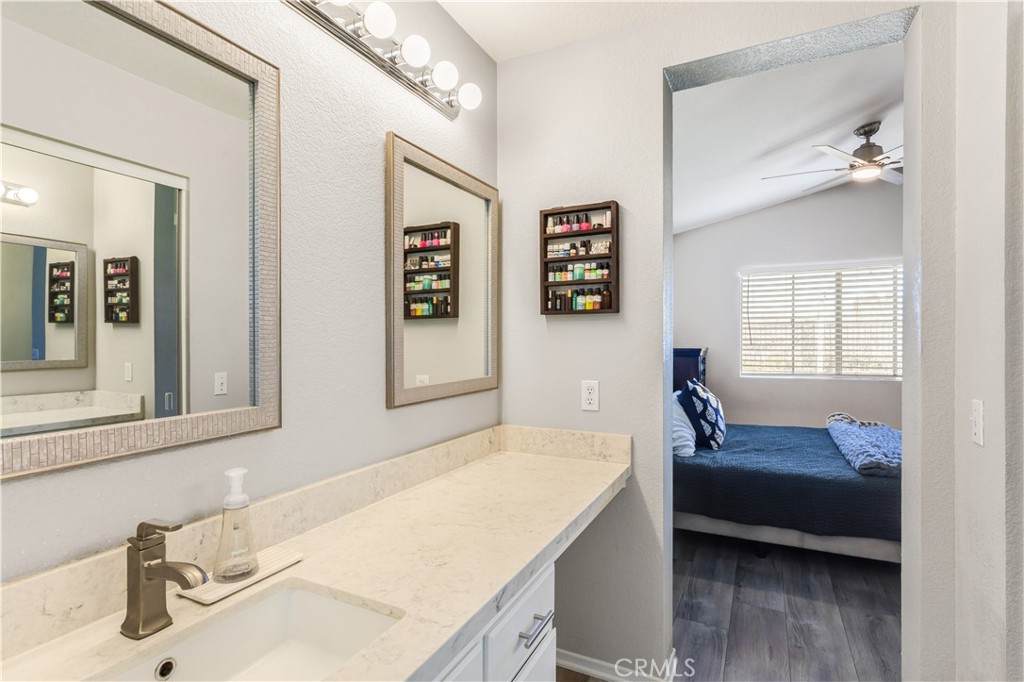 33012 Tulley Ranch Road Temecula, CA 92592 - Photo 19 of 25 a bedroom with a bed and a dresser